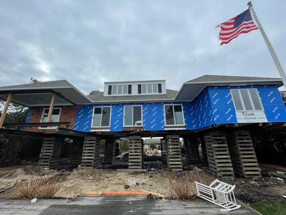 blue house with flag